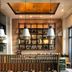 Onomo Hotel Rabat Terminus dining area with banquette seating, hanging pendant lights and open shelving
