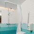 Loft - Hi Eco Hostel Reykjavik bathroom with shower, wall-mounted toilet and turquoise tile