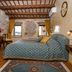Residence Porta Antica Centro Storico Rovinj room with stone walls, wood beams, double bed, and two windows