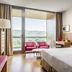 Exe Las Margas Golf Hotel in Latas guest room with balcony and mountain views