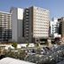 Daiwa Roynet Hotel Sendai in Sendai, city view with adjacent parking lot and surrounding buildings