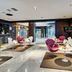 Sercotel Madrid Aeropuerto lobby lounge in Madrid with modern seating and bar area