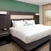 Residence Inn by Marriott New Orleans Elmwood guest room with king bed, TV, and window view
