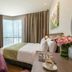 Somerset Medini Iskandar Puteri hotel room in Gelang Patah with city view, bed and desk