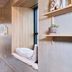 Hotel Guestapart Aarhus interior with built-in window seat, wooden walls and desk nook