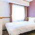 Toyoko Inn Iwaki Ekimae in Iwaki guest room with double bed and window with curtains