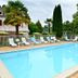 Logis Le Vieux Logis in Lestelle-Bétharram features an outdoor pool with lounge chairs and lush greenery
