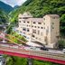 Hotel Obokekyo Mannaka in Miyoshi beside a red bridge and river gorge surrounded by forested mountains
