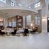 Embassy Suites by Hilton Raleigh Durham Airport Brier Creek lobby lounge with seating and tall windows in Raleigh
