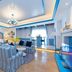 Xianyang Ocean Hotspring World in Xianyang living room with striped sofas, fireplace and blue-accented ceiling