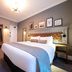 The Hawes Inn by Innkeeper's Collection in South Queensferry guest room with king bed and wall-mounted TV