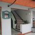 Hotel Casa Lamay in Bogotá reception area with staircase and check-in counter