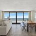Sandpiper Beacon Beach Resort in Panama City Beach with ocean-view living room and balcony