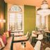 Hotel Villa Klemm - Wiesbaden City dining room with chandeliers, green walls, arched windows and tables