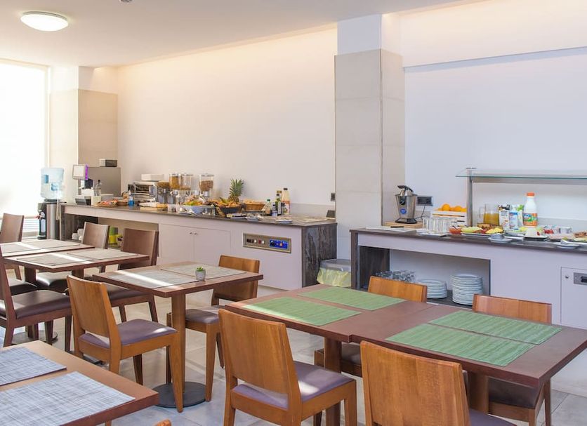 Hotel Marfil in Sant Antoni de Portmany buffet breakfast area with dining tables and coffee station