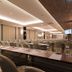 Bella B Hotel in Mueang Nonthaburi meeting room with rows of tables, chairs, and a presentation screen