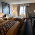 Super 8 by Wyndham Milwaukee Airport guest room with two double beds and window view in Milwaukee