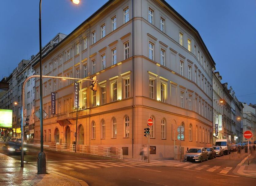 Ea Hotel New Town in Prague, corner hotel building on a city street at dusk