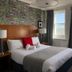 West Rocks Townhouse, Eastbourne bedroom with sea view through two windows