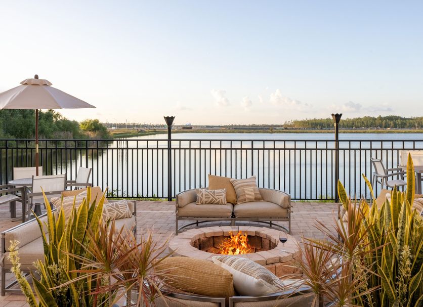 Crowne Plaza Ft. Myers Gulf Coast in Fort Myers, rooftop fire pit lounge with lake view