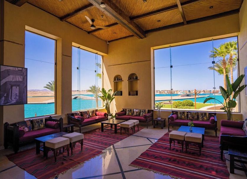Marina Lodge At Port Ghalib lounge with large windows overlooking the marina in Port el Ghalib