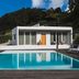 Quinta da Abelheira in Ponta Delgada with outdoor pool, sun loungers, and modern villa backdrop