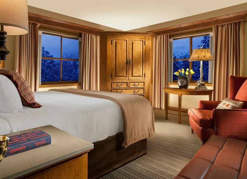 Faraway Jackson Hole in Teton Village guest room with king bed, mountain-view windows and sitting area