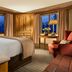 Faraway Jackson Hole in Teton Village guest room with king bed, mountain-view windows and sitting area
