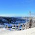 Hafjell Hotell in Øyer (Hafjell) with ski lift over snowy mountain slopes and valley views
