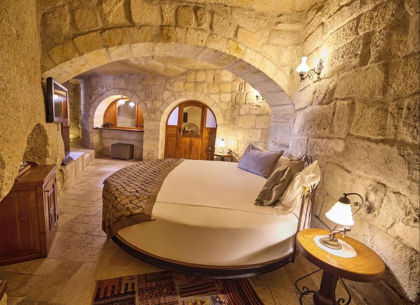 Mithra Cave Cappadocia cave-style bedroom in Göreme with stone walls and arched ceiling