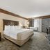 Best Western Black Hills Lodge Spearfish guest room with king bed, desk and window seating