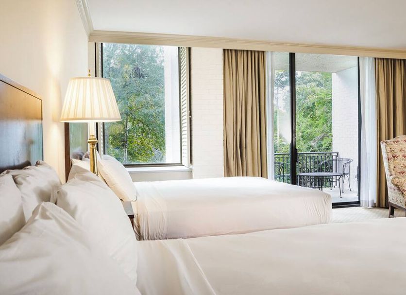 Griffin Hotel, Williamsburg guest room with two beds, floor-to-ceiling windows, and balcony view