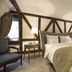 Romantik Hotel Zur Glocke Trier guest room with four-poster bed and exposed wood beams