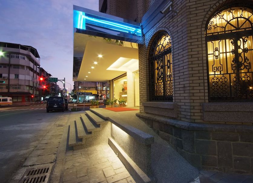 The Metro Hotel - Taipei Branch entrance in Taipei City with lit canopy and street view at dusk