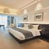 Beijing Lian Jie Hotel room in Beijing with king bed, desk, and large window with city view