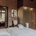 Boutique Hotels Manna & Blue, Nijmegen: modern hotel room with bed, bathroom area, and mirror