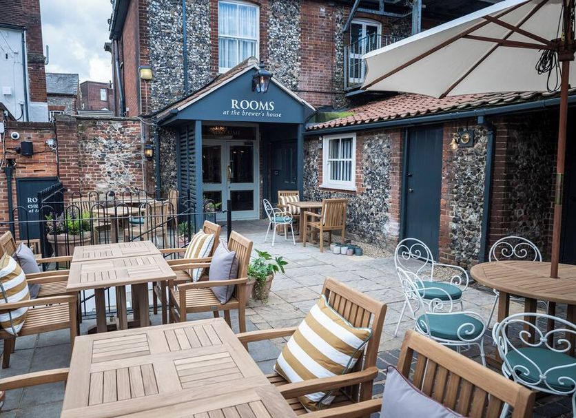 Dog and Partridge by Greene King Inns courtyard seating in Bury St. Edmunds