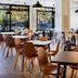 B&B Hotel Figueres breakfast room with tables, chairs and buffet area in Figueres