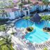 Vh - Gran Ventana Beach Resort in Puerto Plata, aerial view of lagoon-style pool, palm trees and loungers