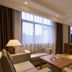 Yong Cun Hotel (Xi'an Bell Tower) in Xi'an guest room with twin beds, seating area and city-view window