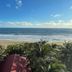Hotel Marbella Playa Larga in Ixtapa with palm trees overlooking a sandy beach and ocean