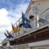 Fletcher Badhotel Egmond aan Zee exterior with balconies and flags in Egmond aan Zee