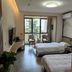 Sea Shore Garden Hotel Qingdao room with two beds and balcony view in Qingdao
