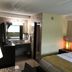 Marvin's Garden Inn in Southfield guest room with king bed and bathroom vanity