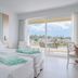 Iberostar Playa Gaviotas in Jandía with twin beds and balcony view of palm trees and ocean