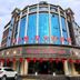 Wuyue Yuexin Hotel (Jinggangshan) in Ji'an, curved glass facade with red lanterns at entrance