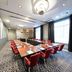 Bilderberg Grand Hotel Wientjes meeting room in Zwolle with U-shaped conference table and red chairs