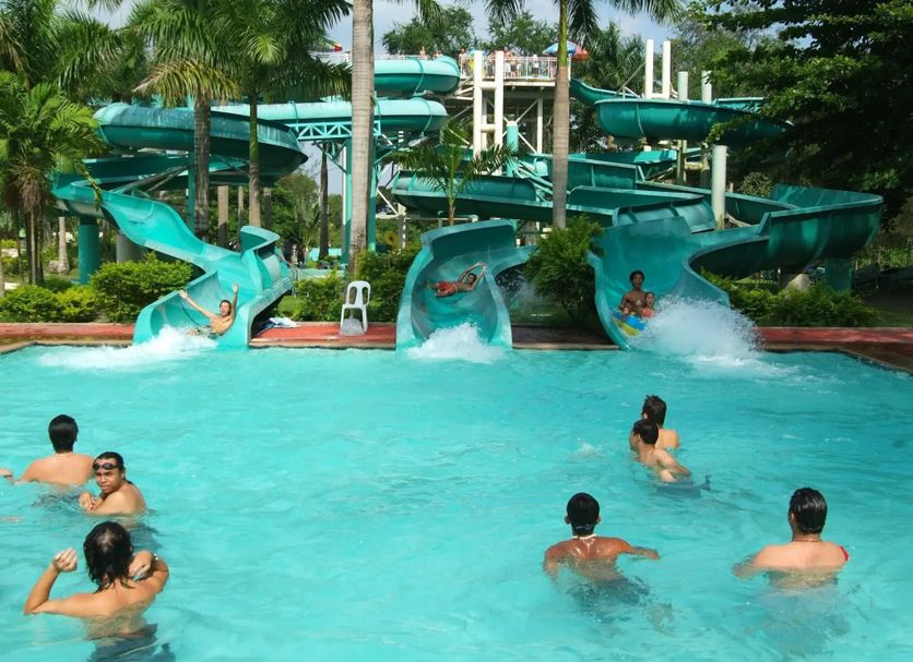 Fontana Hot Spring Leisure Parks in Angeles City with a water slide pool and swimmers