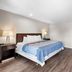 Econo Lodge Panguitch near Bryce Canyon guest room with king bed, TV, nightstands and closet