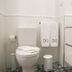 Bo - Álvares Cabral Guesthouse bathroom in Porto with toilet, towels, and shower glass panel